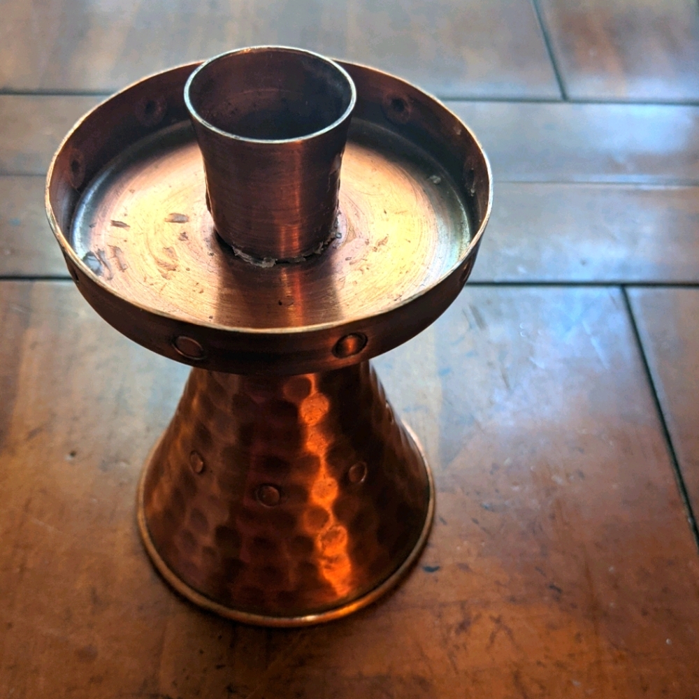 Copper candle holder.